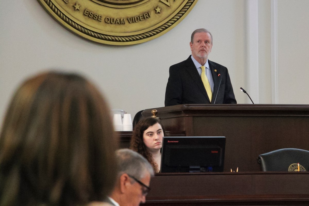 Phil Berger stands at a lecturn
